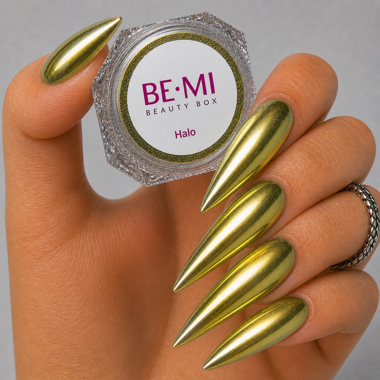 Finished manicured nails with a high-shine liquid metal effect using BEMI Chrome in Halo, burnished flawlessly over a gel base for professional nail artistry.