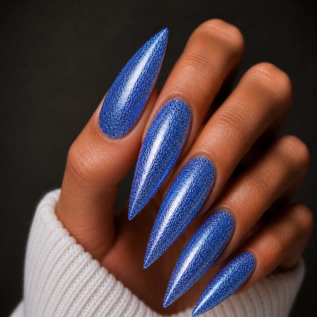 Finished manicured nails using BEMI Metal Leaf Gel in Neptune, demonstrating a multidimensional, metallic effect and a flawless, professional finish.