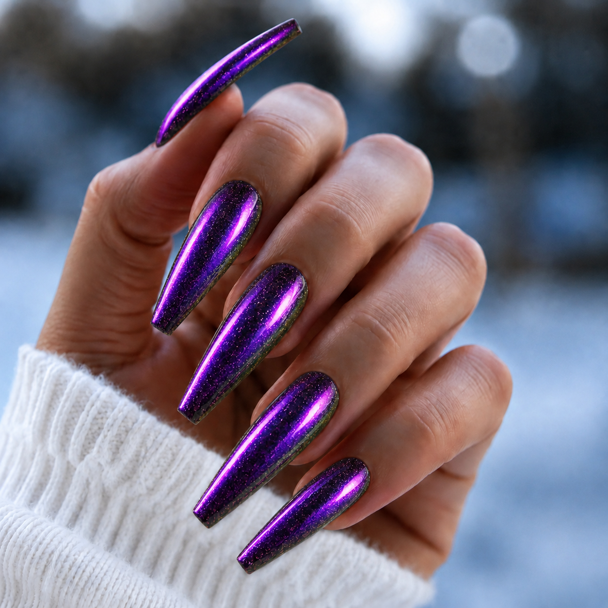 Finished manicured nails with a high-shine liquid metal effect using BEMI Chrome in Bloom, burnished flawlessly over a gel base for professional nail artistry.