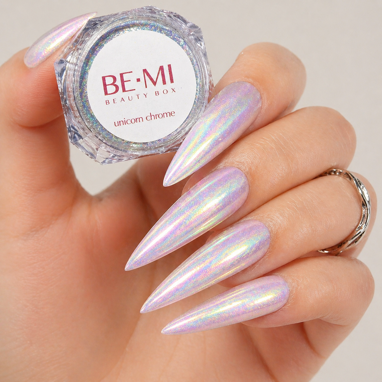 Finished manicured nails with a high-shine liquid metal effect using BEMI Chrome in Unicorn, burnished flawlessly over a gel base for professional nail artistry.