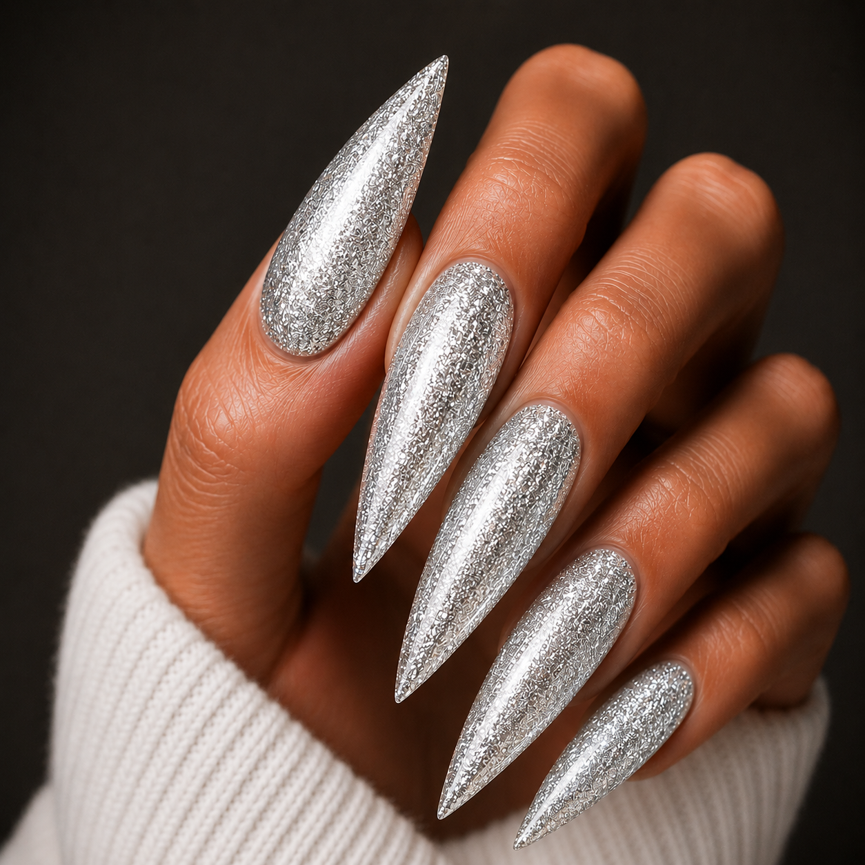 Finished manicured nails using BEMI Metal Leaf Gel in Silver, demonstrating a multidimensional, metallic effect and a flawless, professional finish.