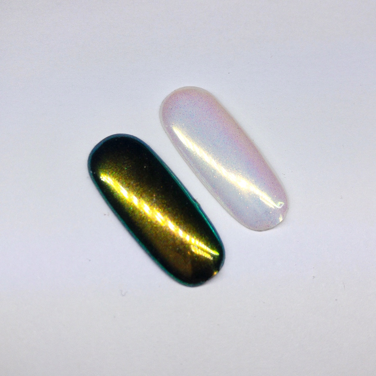 Finished manicured nails with a high-shine liquid metal effect using BEMI Chrome in Unicorn, burnished flawlessly over a gel base for professional nail artistry.